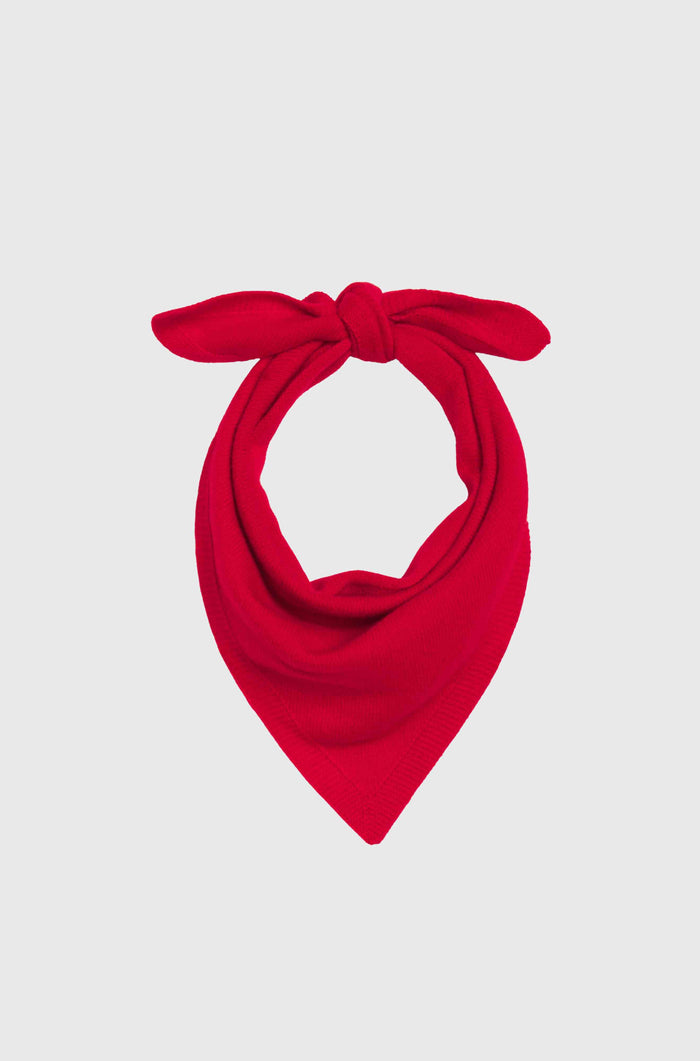 Red bandana with a knot on a light gray background